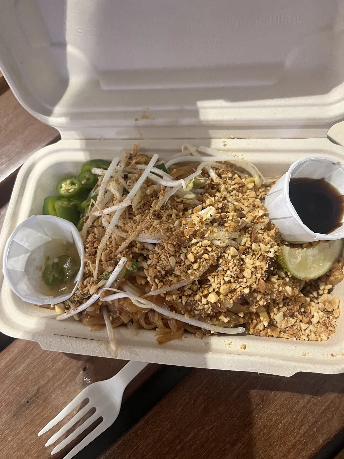 Customer ordering food at the Super Thai food truck window